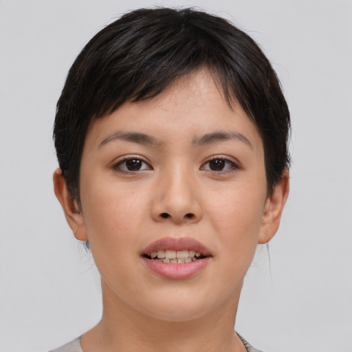 Joyful asian young-adult female with short  brown hair and brown eyes