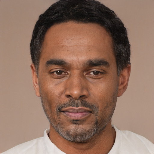 Neutral latino adult male with short  black hair and brown eyes