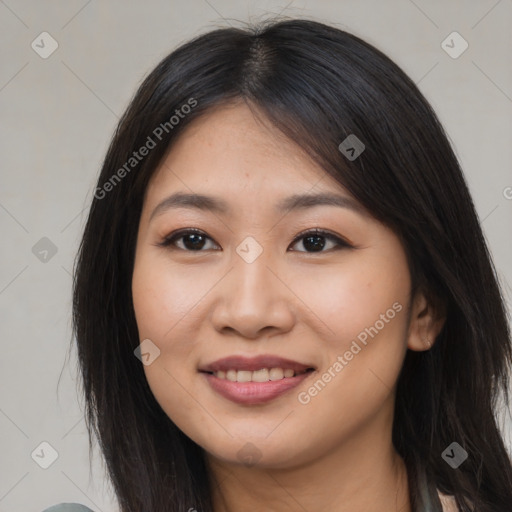 Joyful asian young-adult female with long  brown hair and brown eyes