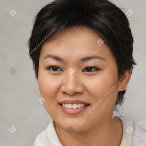 Joyful asian young-adult female with short  brown hair and brown eyes