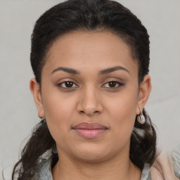 Joyful latino young-adult female with short  brown hair and brown eyes