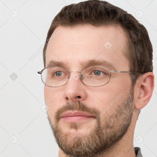 Joyful white adult male with short  brown hair and grey eyes