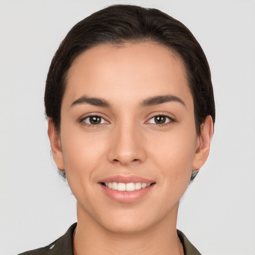 Joyful white young-adult female with short  brown hair and brown eyes