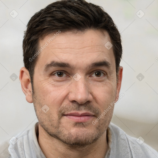 Joyful white adult male with short  brown hair and brown eyes