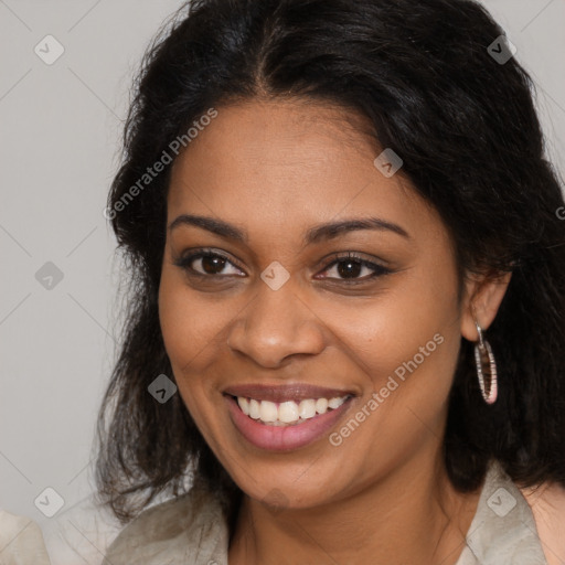 Joyful black young-adult female with long  brown hair and brown eyes