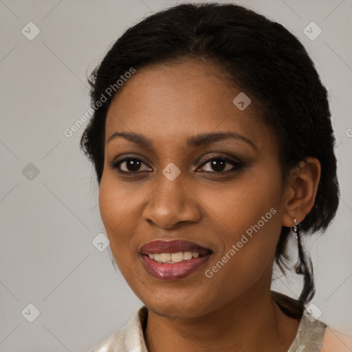 Joyful black young-adult female with medium  brown hair and brown eyes