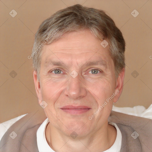 Joyful white middle-aged male with short  brown hair and brown eyes