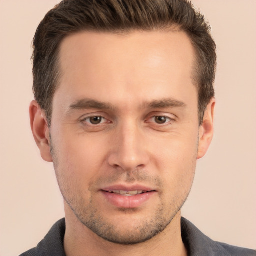 Joyful white young-adult male with short  brown hair and brown eyes