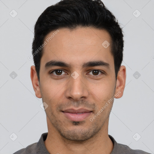 Joyful white young-adult male with short  black hair and brown eyes