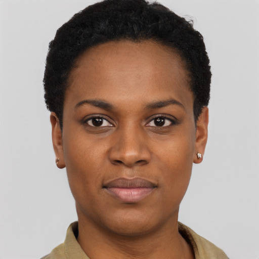 Joyful black young-adult female with short  black hair and brown eyes