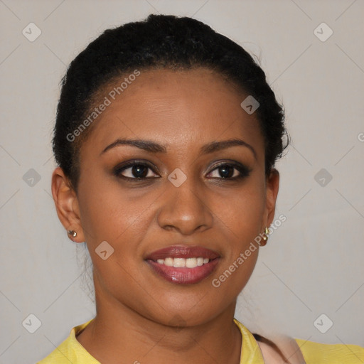 Joyful black young-adult female with short  brown hair and brown eyes