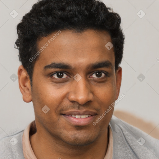 Joyful black young-adult male with short  brown hair and brown eyes