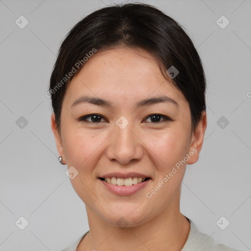 Joyful asian young-adult female with short  brown hair and brown eyes