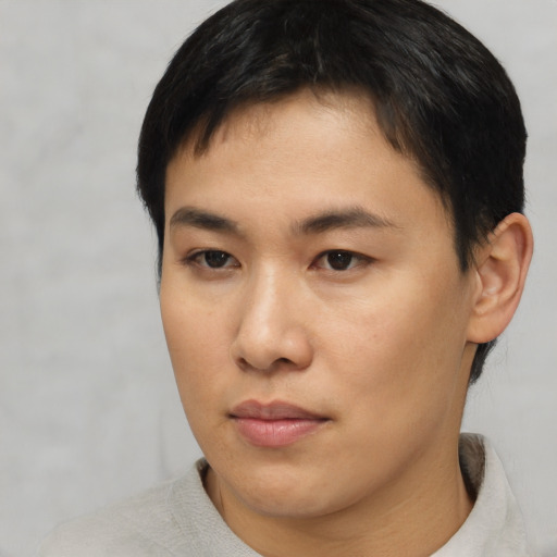 Neutral asian young-adult male with short  brown hair and brown eyes