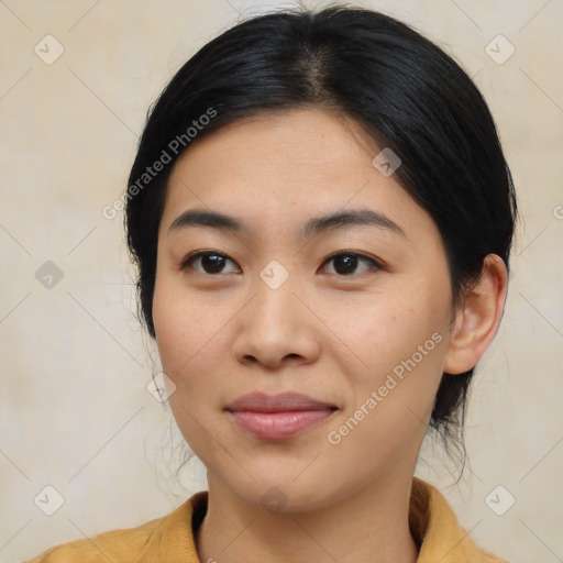 Joyful asian young-adult female with medium  black hair and brown eyes