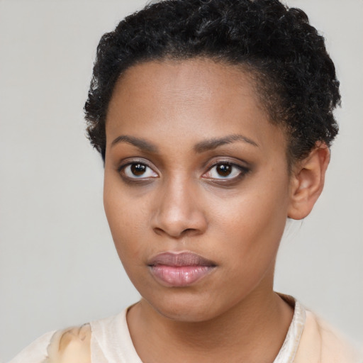 Neutral black young-adult female with short  brown hair and brown eyes