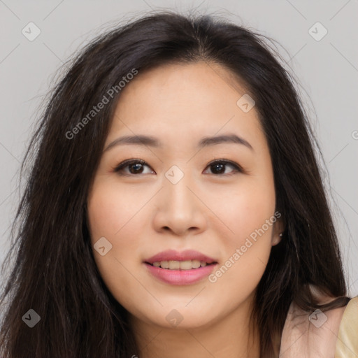 Joyful asian young-adult female with long  brown hair and brown eyes