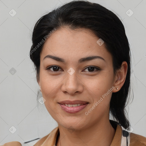 Joyful latino young-adult female with medium  brown hair and brown eyes