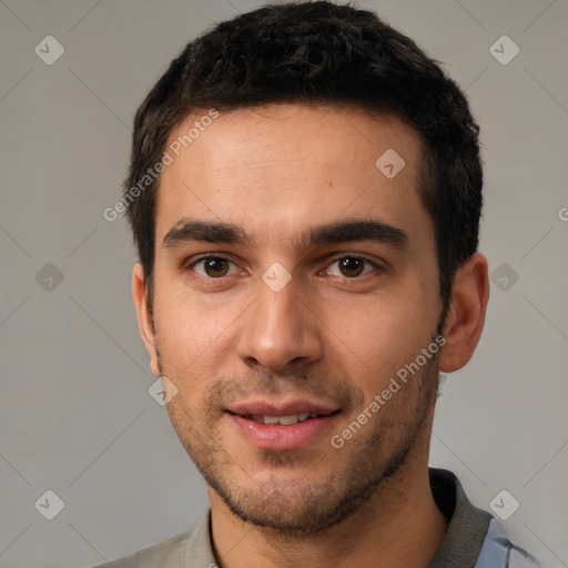 Joyful white young-adult male with short  black hair and brown eyes