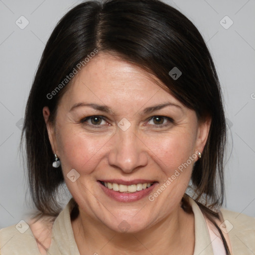 Joyful white adult female with medium  brown hair and brown eyes