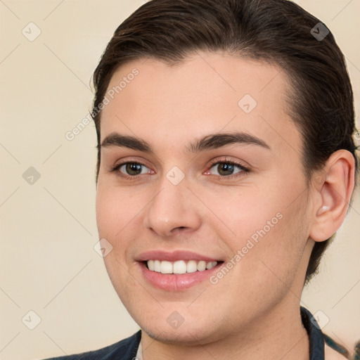 Joyful white young-adult female with short  brown hair and brown eyes