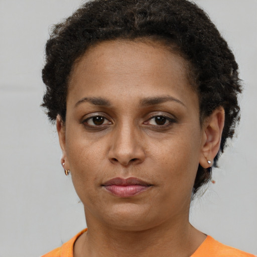 Neutral black young-adult female with short  brown hair and brown eyes