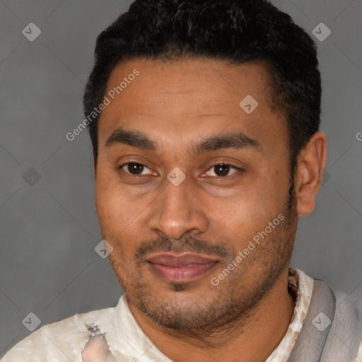 Joyful latino young-adult male with short  black hair and brown eyes