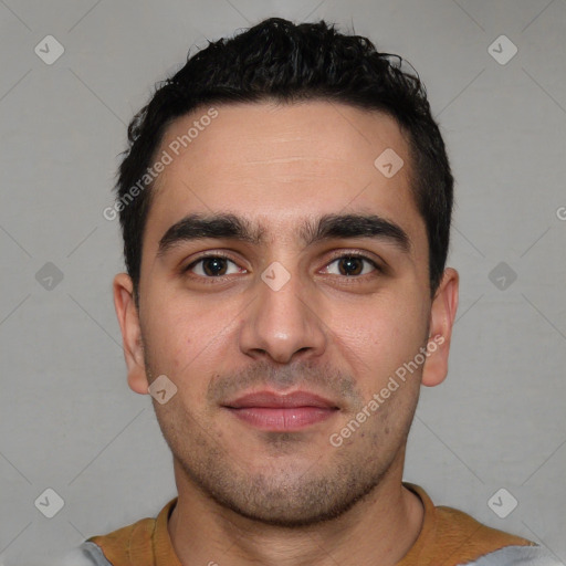 Joyful white young-adult male with short  black hair and brown eyes