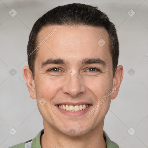 Joyful white adult male with short  brown hair and brown eyes