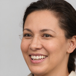 Joyful white adult female with medium  brown hair and brown eyes