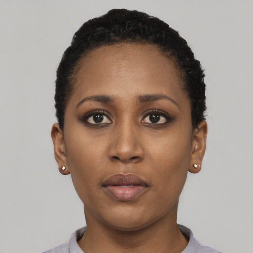 Neutral black young-adult female with short  black hair and brown eyes