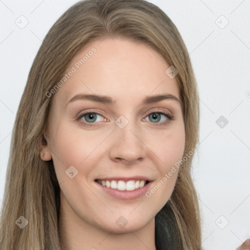 Joyful white young-adult female with long  brown hair and green eyes