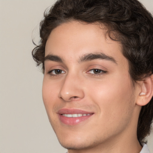 Joyful white young-adult male with medium  brown hair and brown eyes