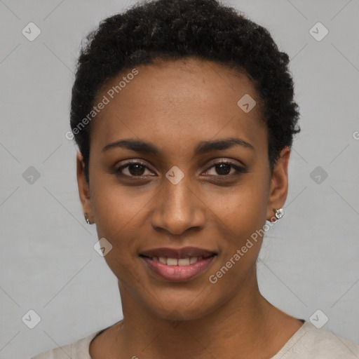 Joyful black young-adult female with short  black hair and brown eyes