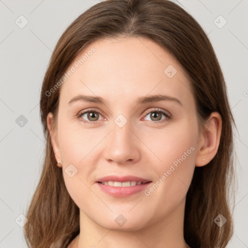 Joyful white young-adult female with long  brown hair and grey eyes