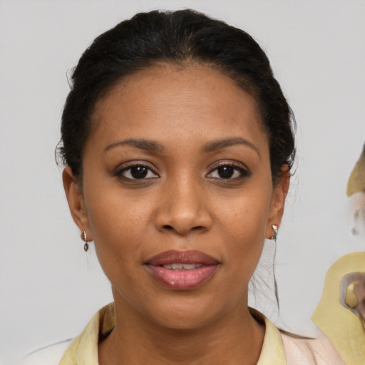Joyful latino young-adult female with medium  brown hair and brown eyes