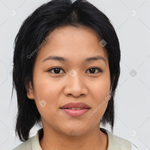 Joyful asian young-adult female with medium  black hair and brown eyes