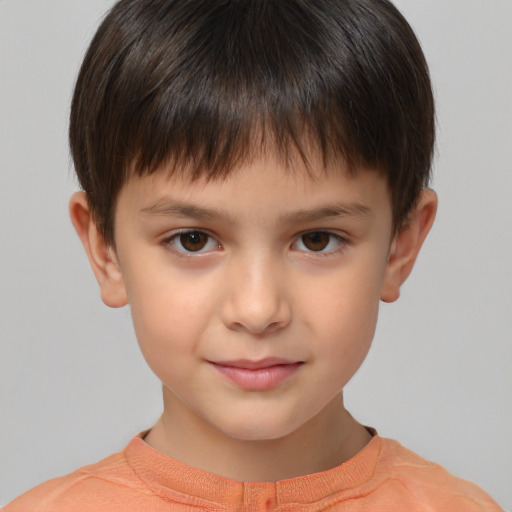 Joyful white child male with short  brown hair and brown eyes