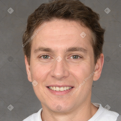 Joyful white adult male with short  brown hair and grey eyes