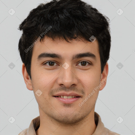 Joyful latino young-adult male with short  brown hair and brown eyes