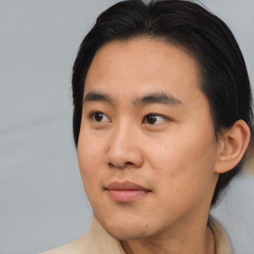 Neutral asian young-adult male with medium  brown hair and brown eyes