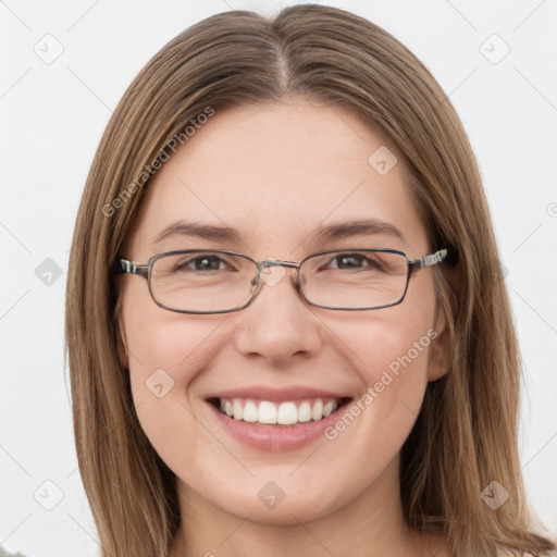 Joyful white young-adult female with long  brown hair and green eyes