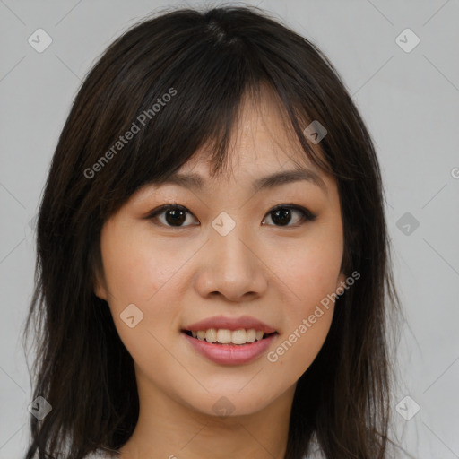 Joyful asian young-adult female with long  brown hair and brown eyes