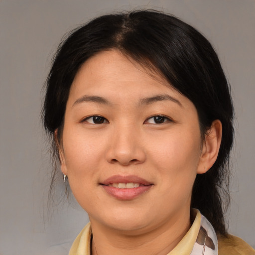 Joyful asian young-adult female with medium  brown hair and brown eyes