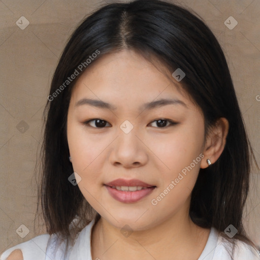 Joyful asian young-adult female with long  brown hair and brown eyes