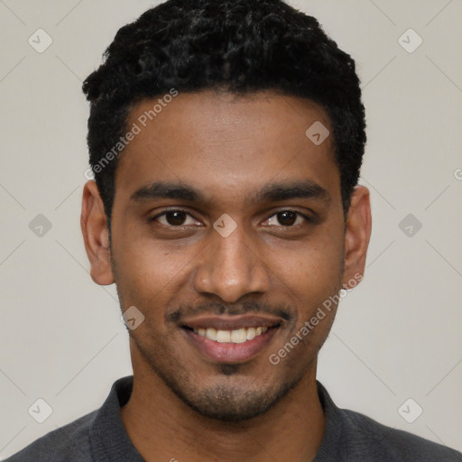 Joyful black young-adult male with short  black hair and brown eyes