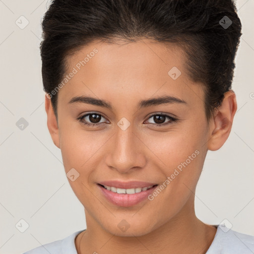 Joyful white young-adult female with short  brown hair and brown eyes