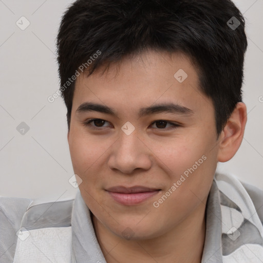 Joyful asian young-adult male with short  brown hair and brown eyes
