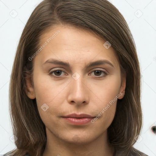 Neutral white young-adult female with long  brown hair and brown eyes