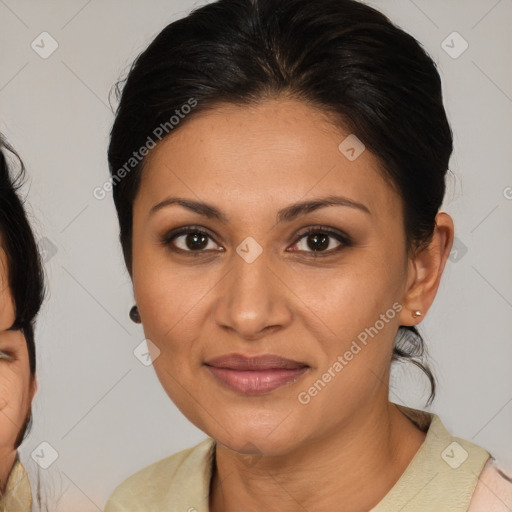 Joyful latino young-adult female with medium  brown hair and brown eyes